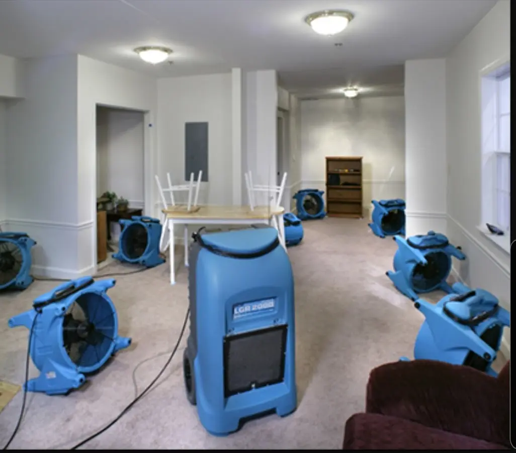 Air movers and dehumidifier setup for Water Damage Restoration in Quincy